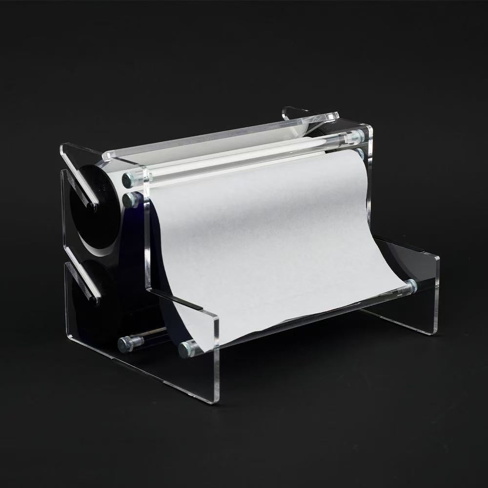 tattoo transfer paper roll in acrylic holder for smooth stencil feeding and workflow